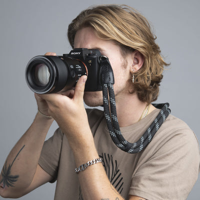 Photographer using Sony camera with COOPH Double Rope Camera Strap 