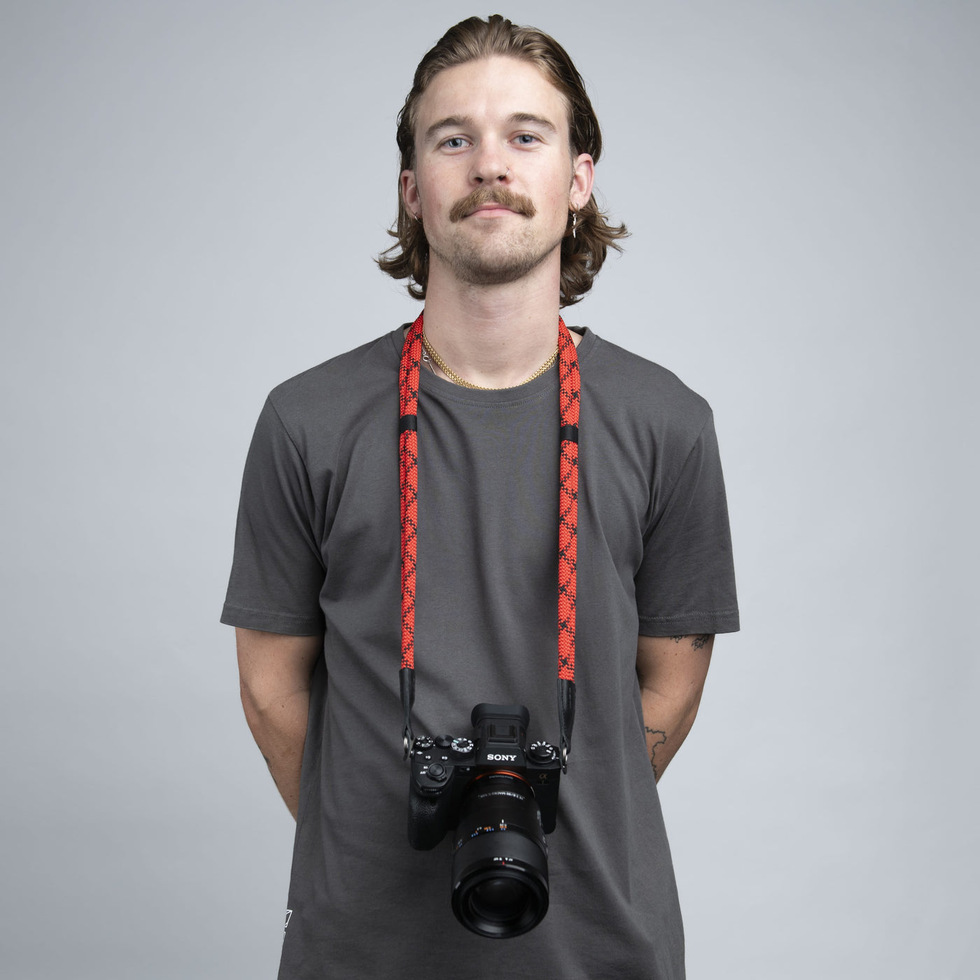Photographer wearing Sony camera around the neck with Double Rope Camera Strap 