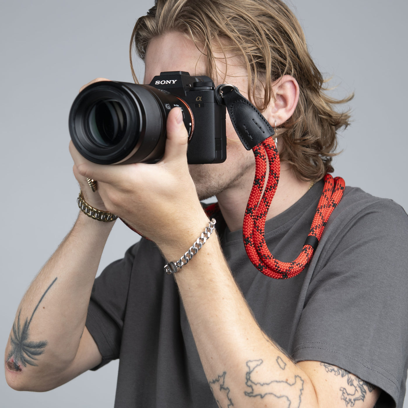 Photographer using Sony camera with COOPH Double Rope Camera Strap 