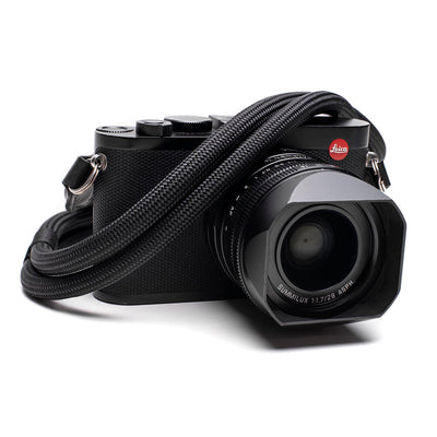 Black Leica camera with a black Leica Double Rope Strap 