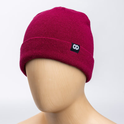 Berry beanie with cooph logo on a mannequin head against a light gray background 