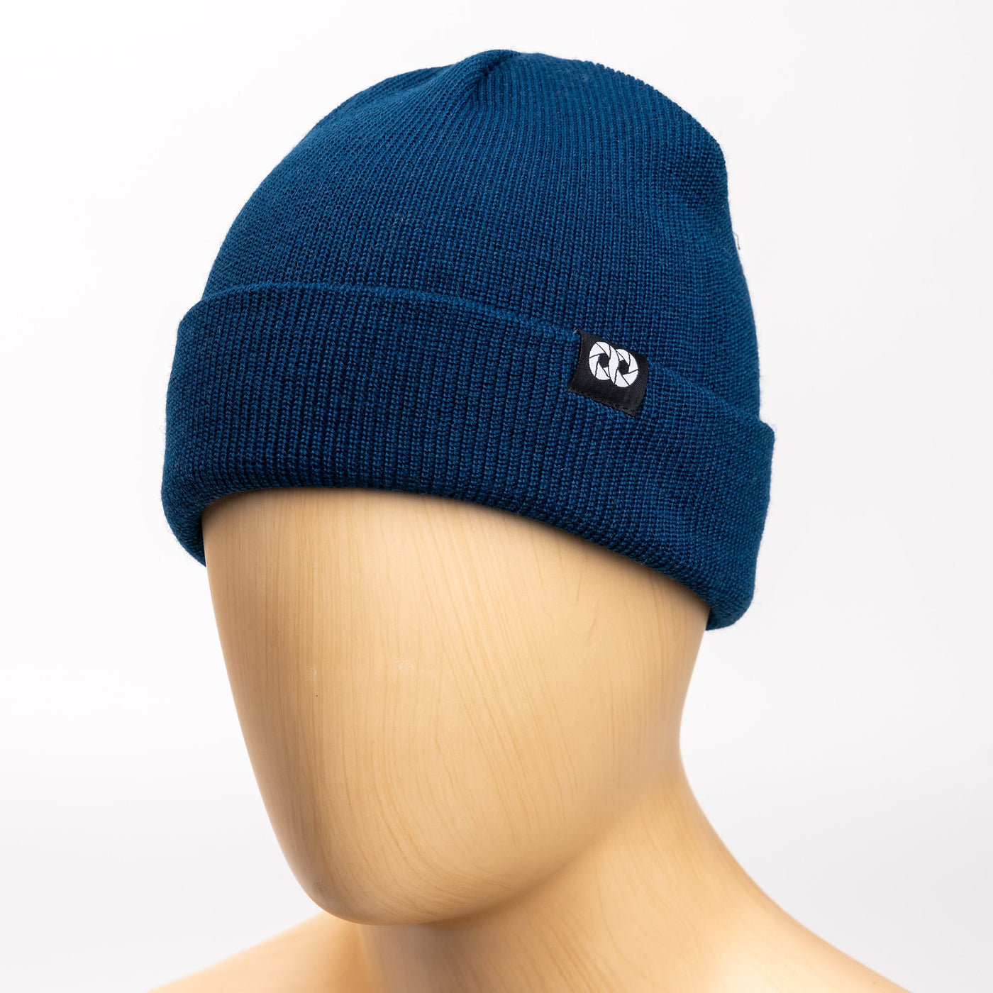 Blue edc beanie with cooph logo on a mannequin head against a white background 