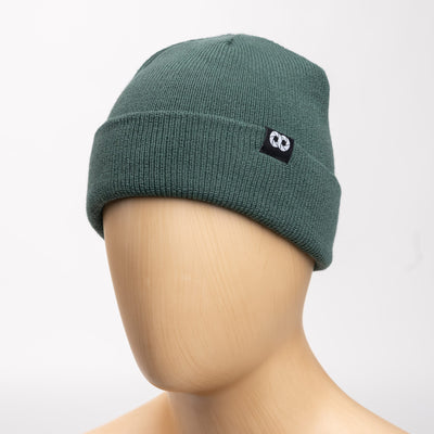 Moss beanie with a logo on a mannequin head against a white background 