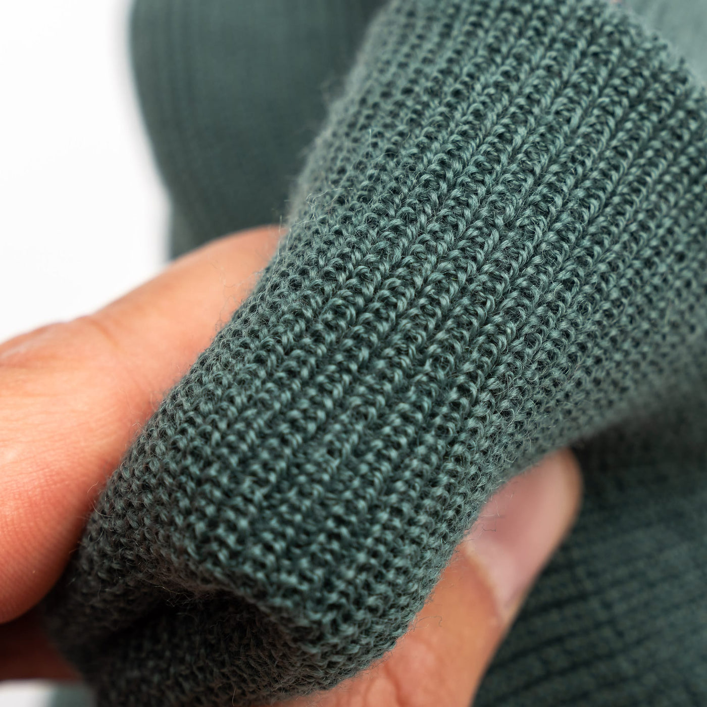 Close-up of edc beanie fabric in moss colour-way 