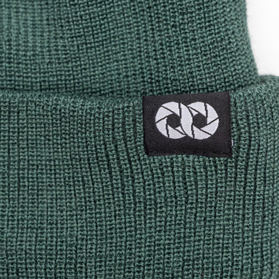Detail of Moss edc beanie with cooph logo tag on a white background --big 
