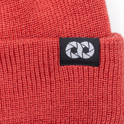 Salmon edc beanie with a black label featuring white cooph logo on a white background  --big 