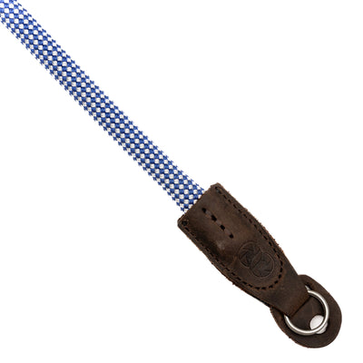 Blue and white checkered rope camera strap with brown leather steel ring endings on white background 