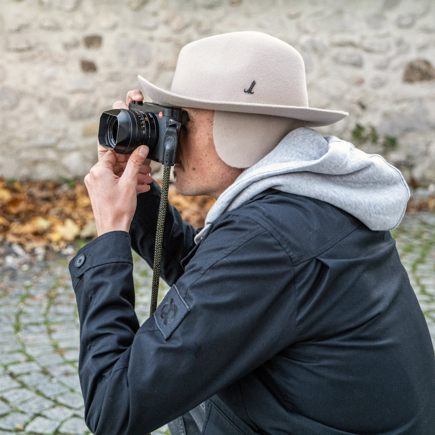 Photographer wearing the Cooph Tempest Hat by Mühlbauer in the birch colorway. 