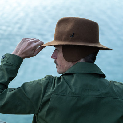 Photographer wearing the Cooph Tempest Hat by Mühlbauer in the gold colorway. 