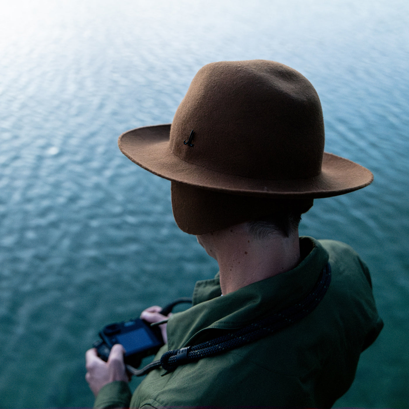 Photographer wearing the Cooph Tempest Hat by Mühlbauer in the gold colorway. -big 