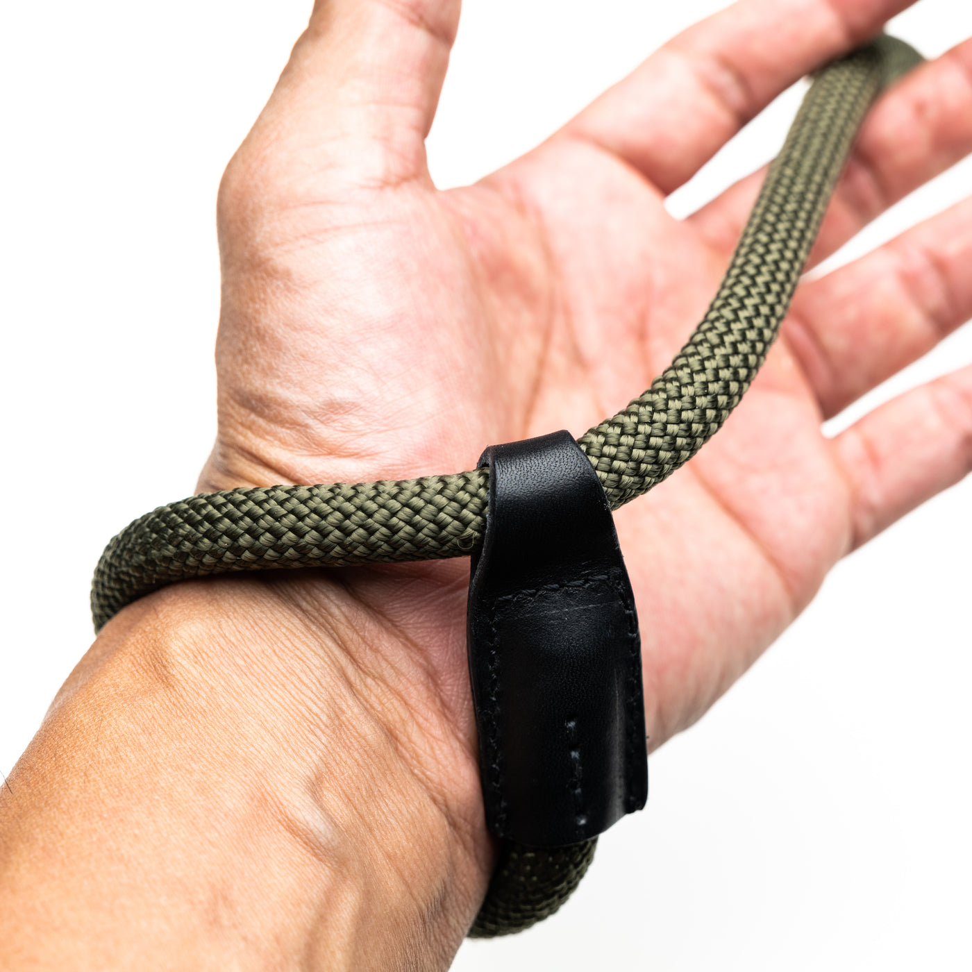 Photographer's wrist showing tightening method of Rope Hand Strap 