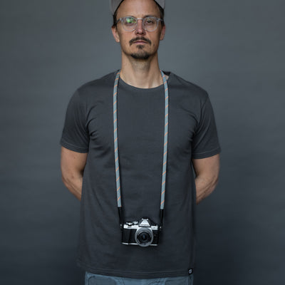 Photographer wearing Olympus camera around the neck with Rope Camera Strap 