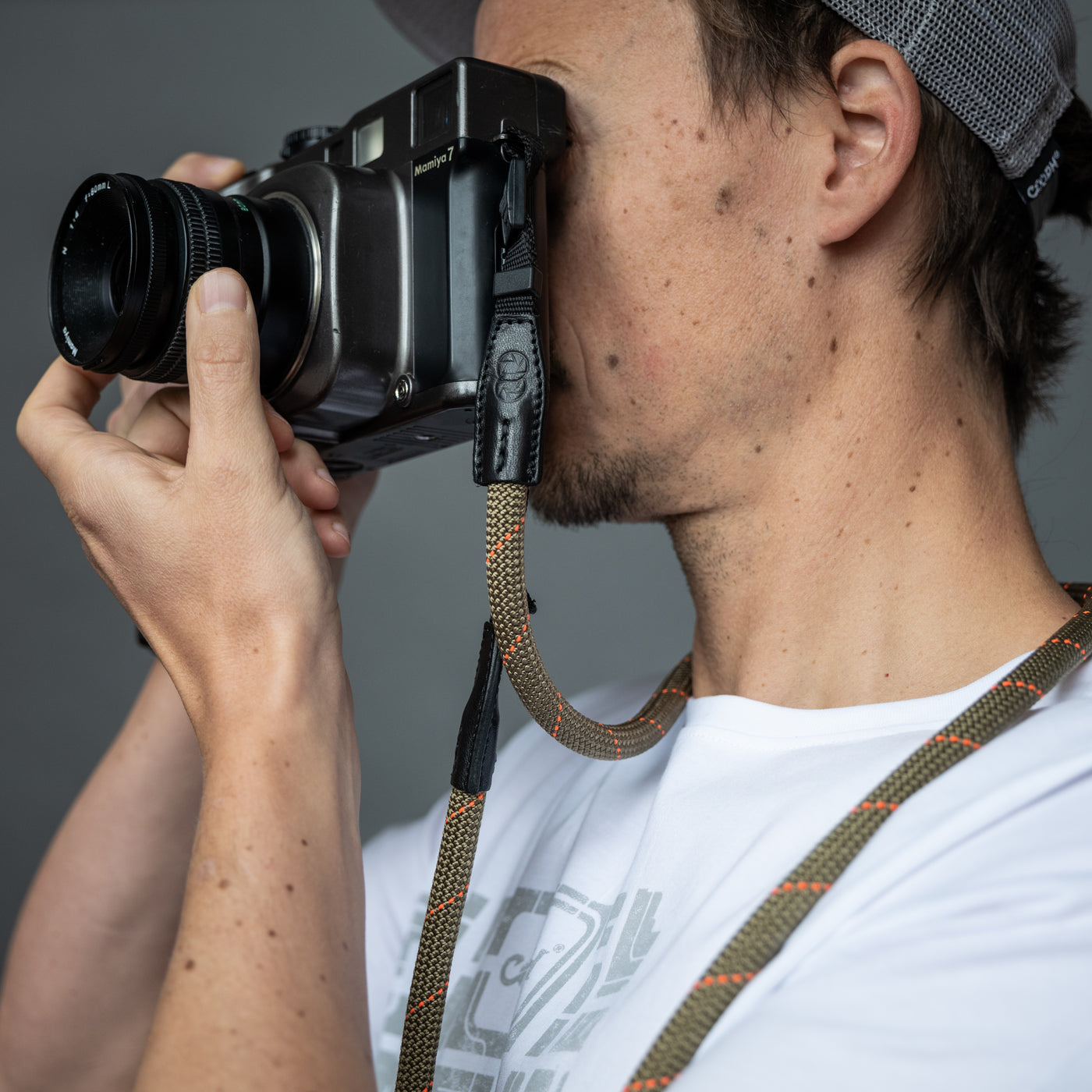 Photographer using retro camera with COOPH Rope Camera Strap 