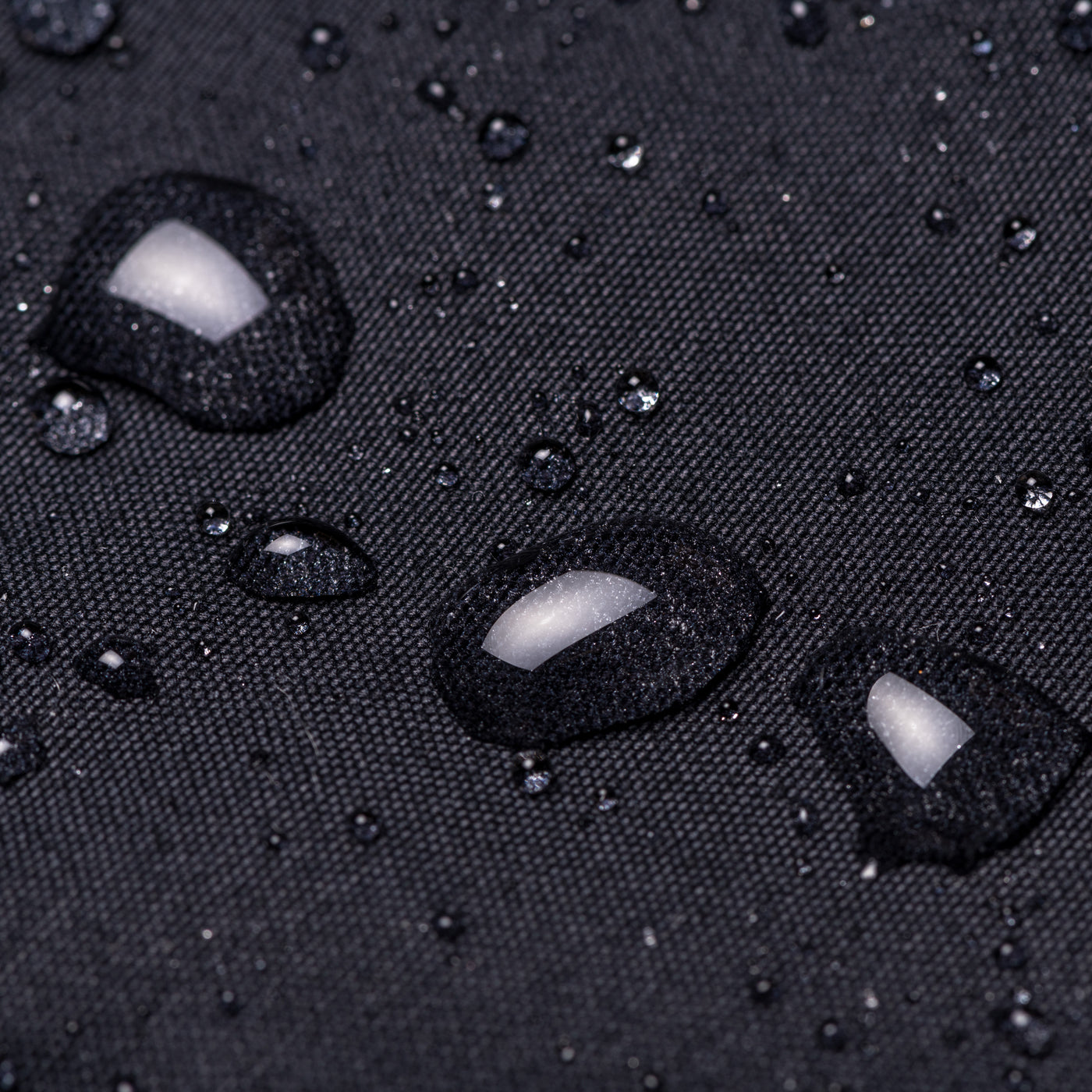 Close up of the weatherproof cotton showing water beading on the surface 