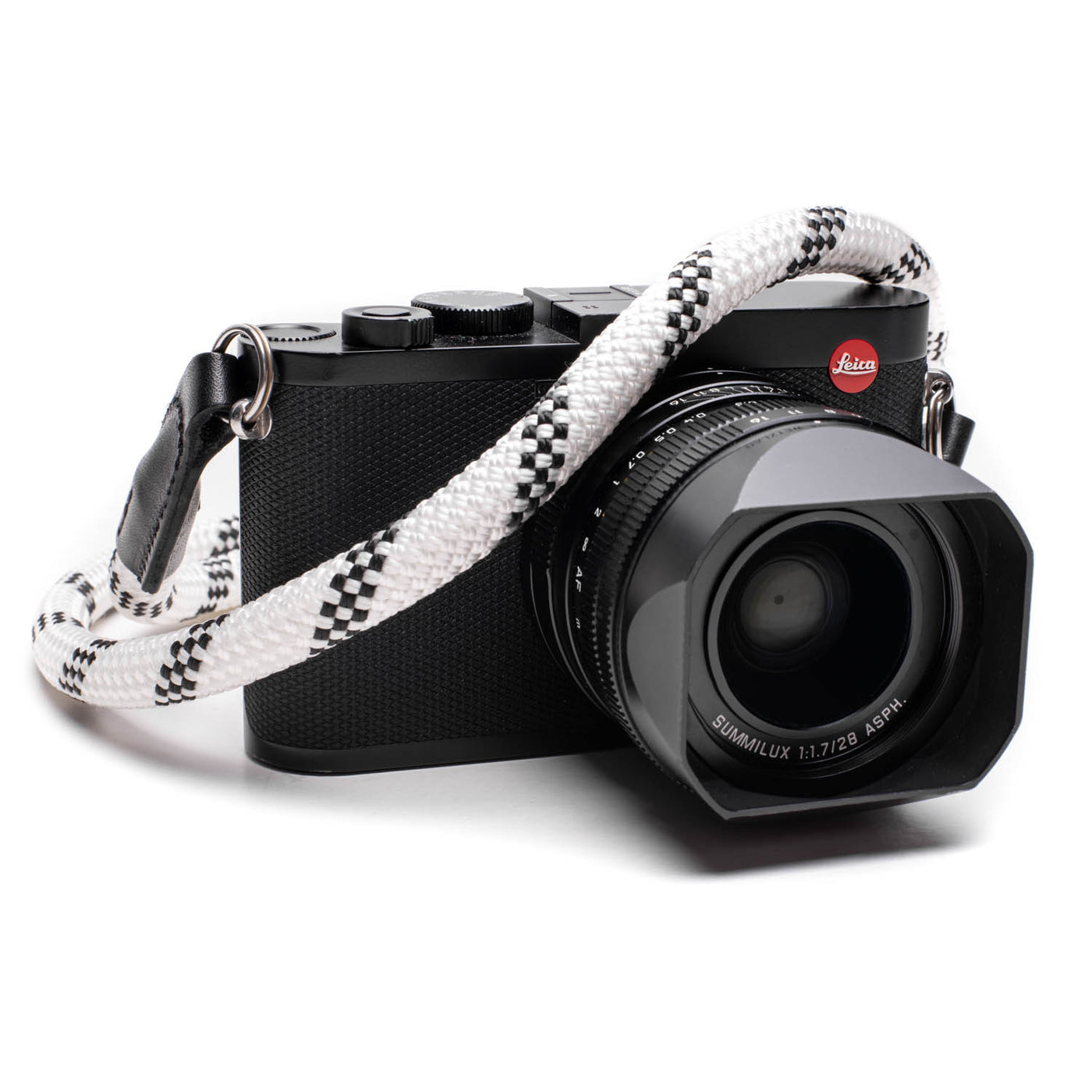 Black Leica camera with a white rope strap 