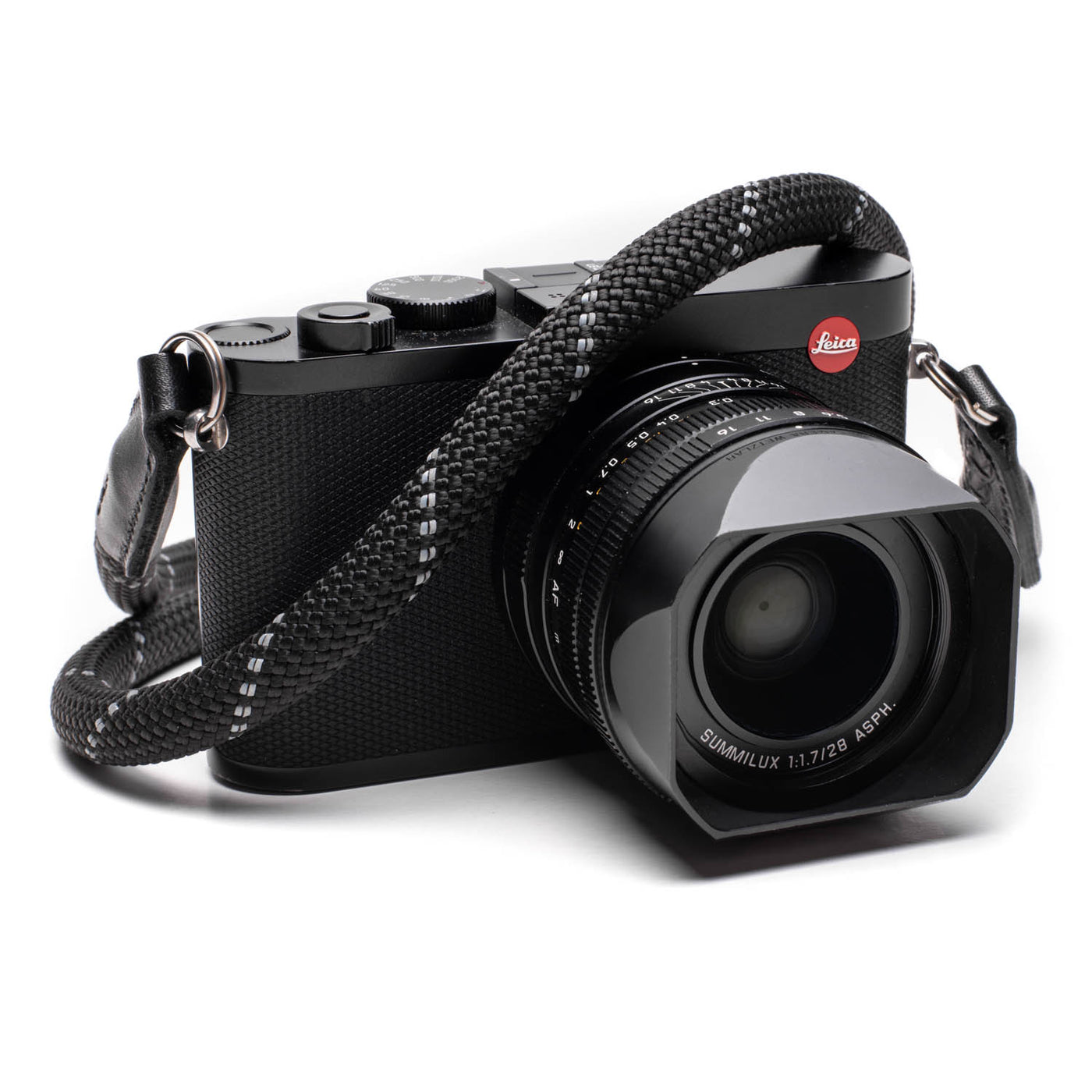 Black Leica camera with a black rope strap 