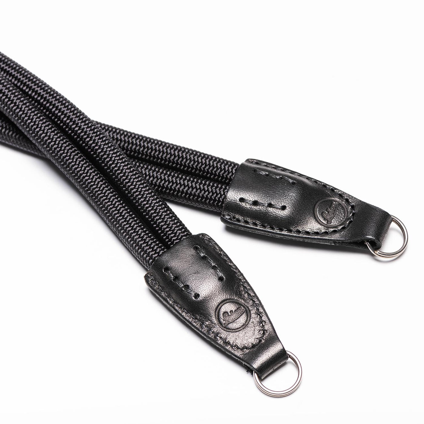 Leather ends of double rope strap with steel ring and Leica embossing 