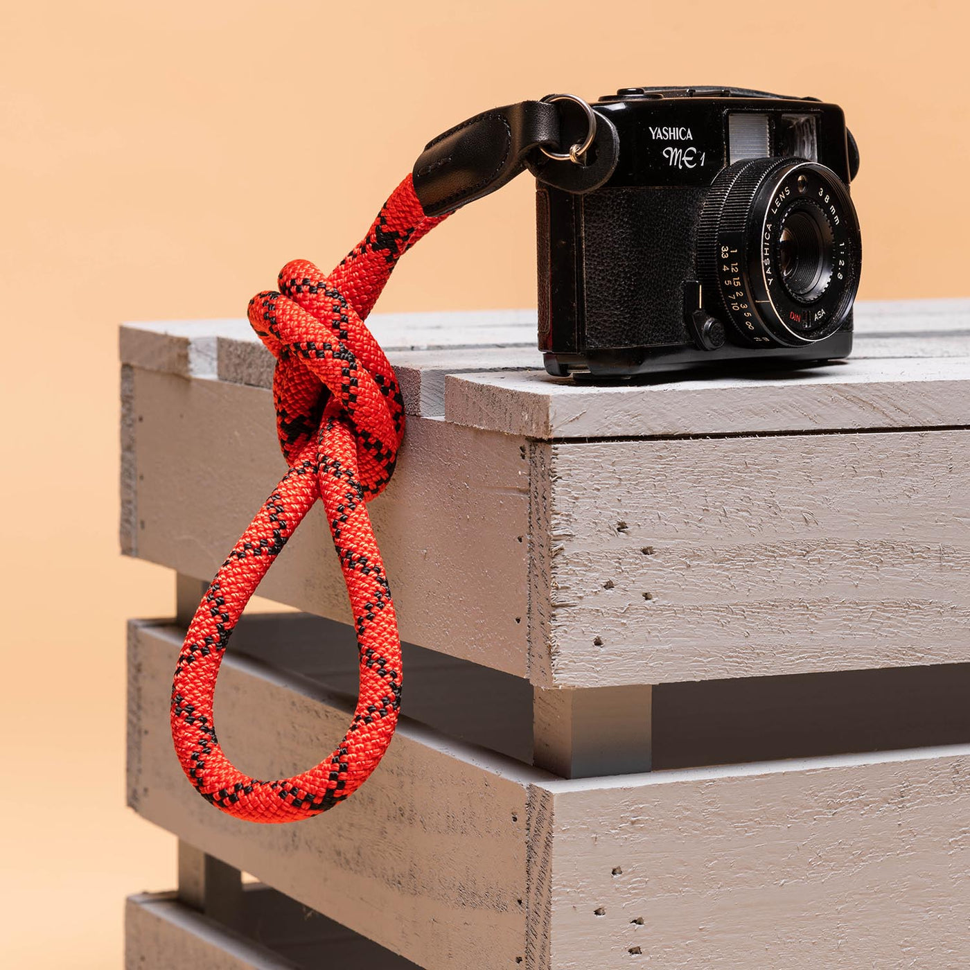 Yashica Camera with a rope strap tied in a knot 