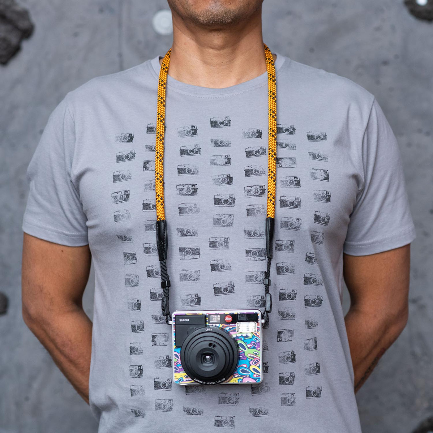 Photographer wearing Leica camera around the neck with Rope Camera Strap 