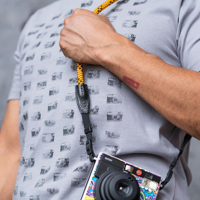 Photographer wearing Leica camera over the shoulder with Rope Camera Strap 