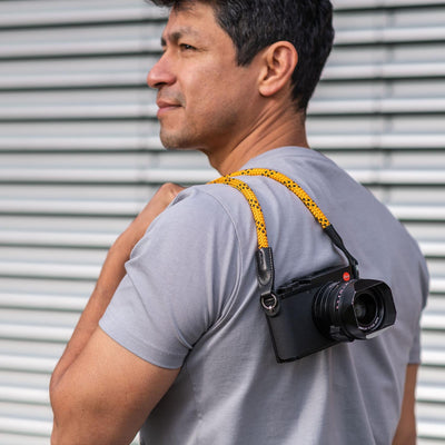Photographer wearing Leica camera over the shoulder with Rope Camera Strap 